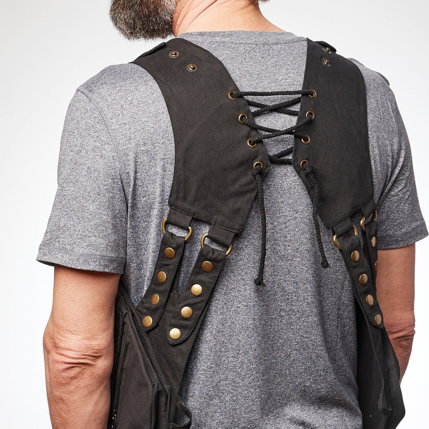 Rear view of the Rigged Thing Signature Holster Rig showing the adjustable corset-style lacing and reinforced hardware for a custom fit.